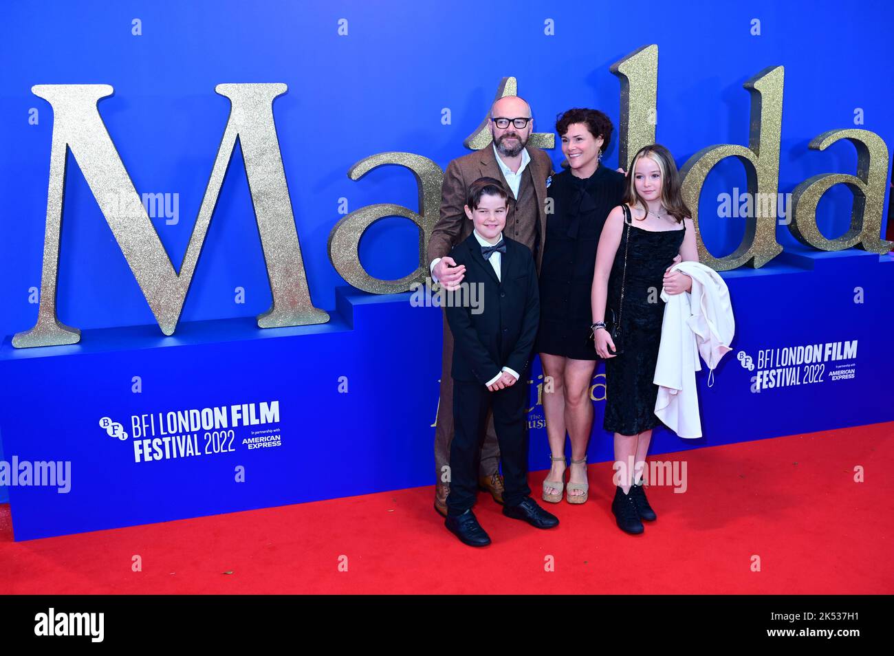 London, UK , 05/10/2022, Dennis Kelly and family Arrive at the Cast and filmmakers attend the BFI London Film Festival press conference for Roald Dahl’s Matilda The Musical, released by Sony Pictures in cinemas across the UK & Ireland on November 25th -  5th October 2022, London, UK. Stock Photo