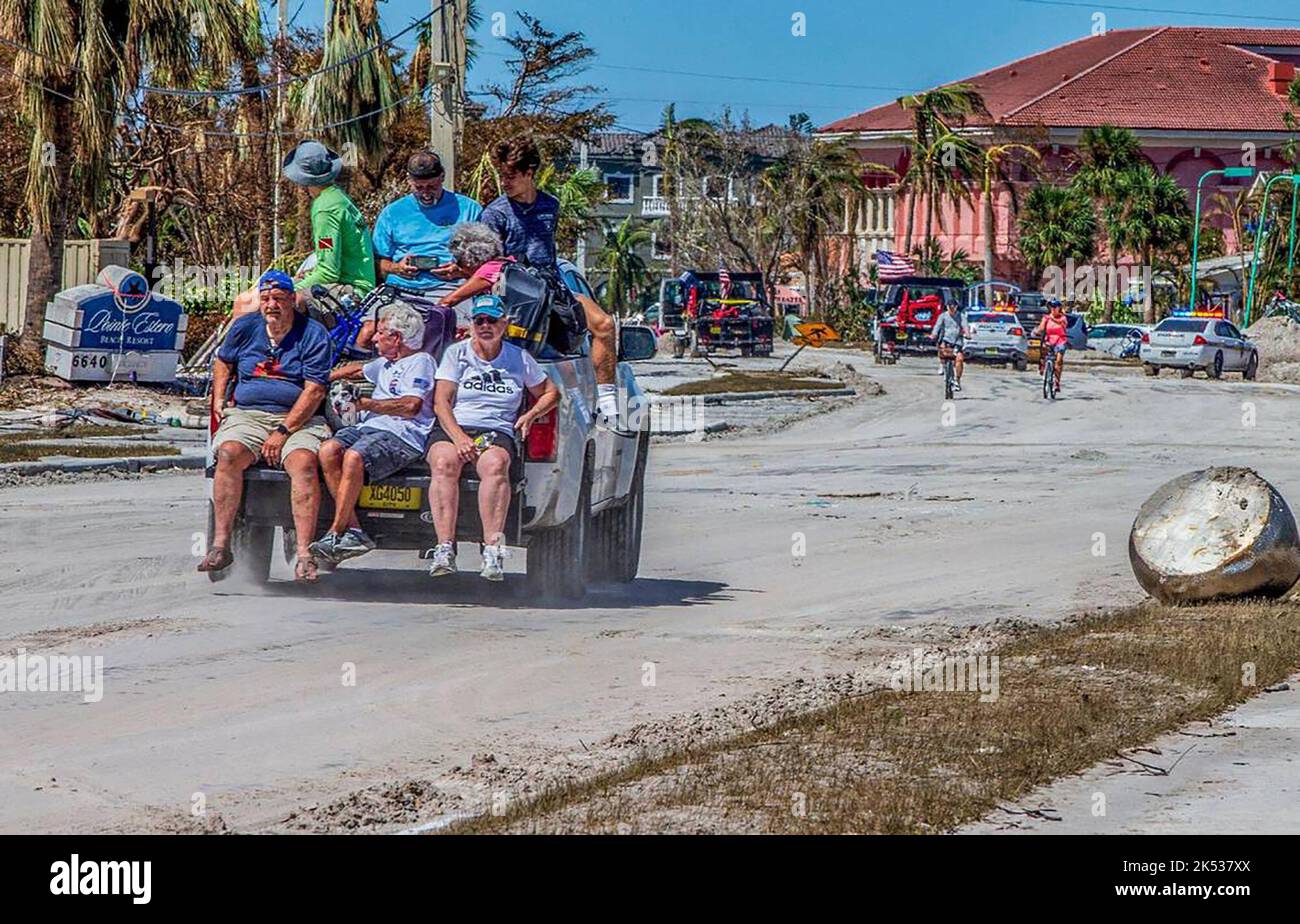 Hurricanes. Leave Residents are transported by rescue personnel along Estero Boulevard ...