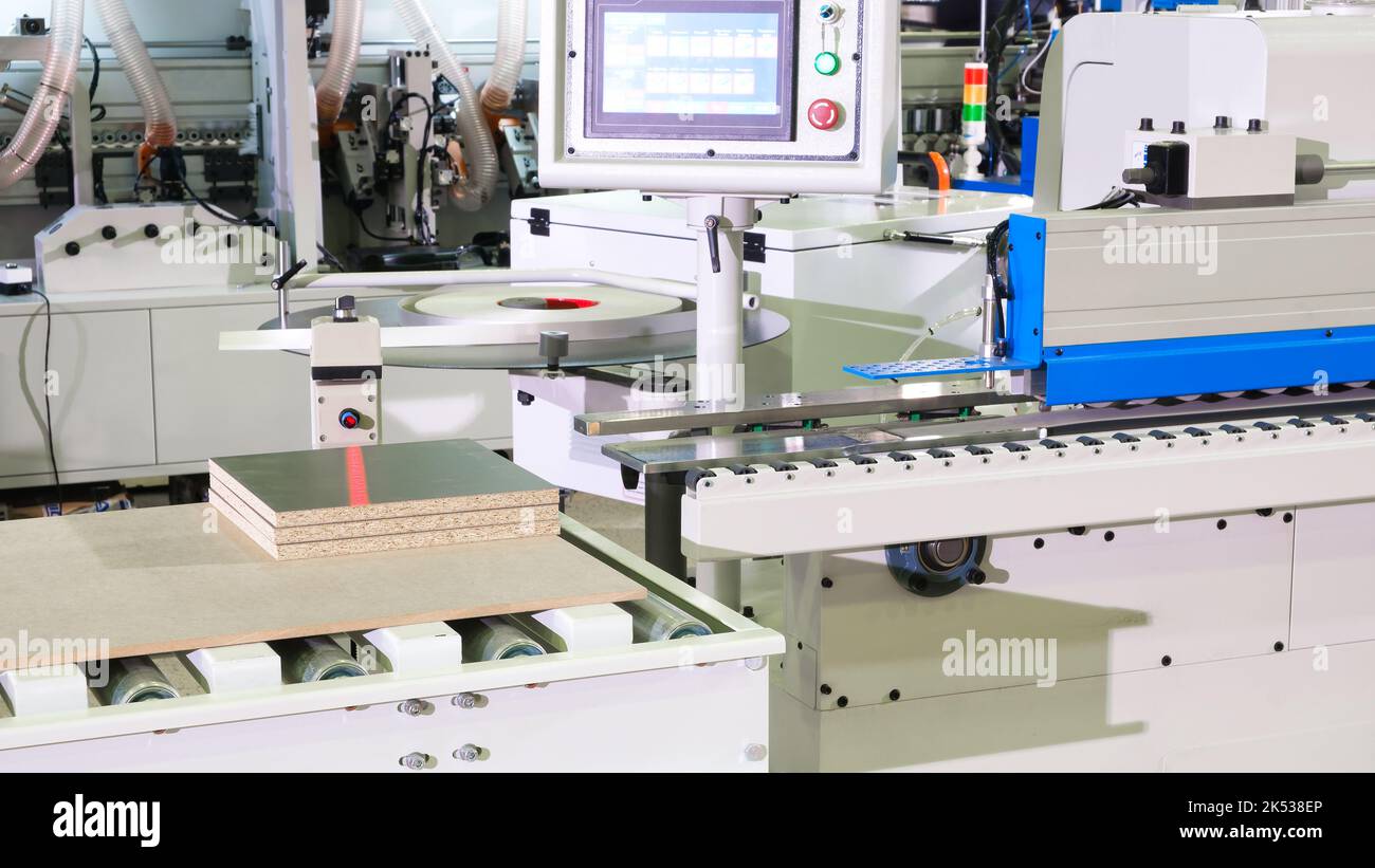 Machine tools format cutting are cut chipboard furniture Stock Photo ...