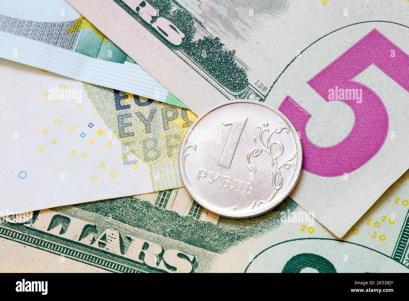 one-ruble-against-the-background-of-euro-and-dollar-banknotes