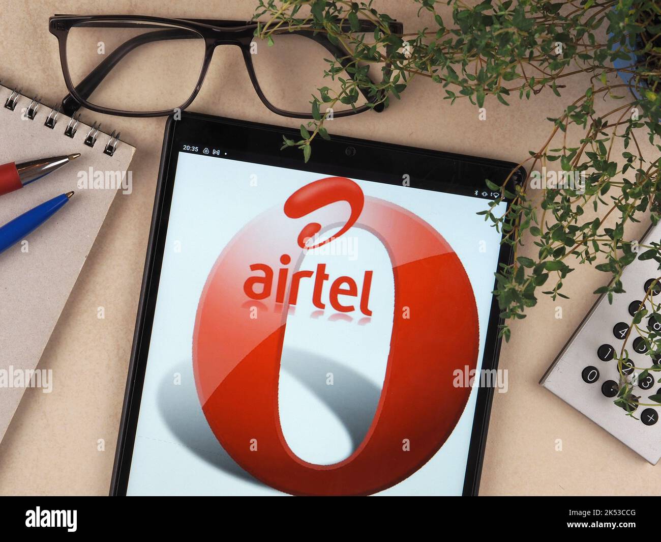 In this photo illustration, Bharti Airtel Limited logo seen displayed on a tablet. Stock Photo