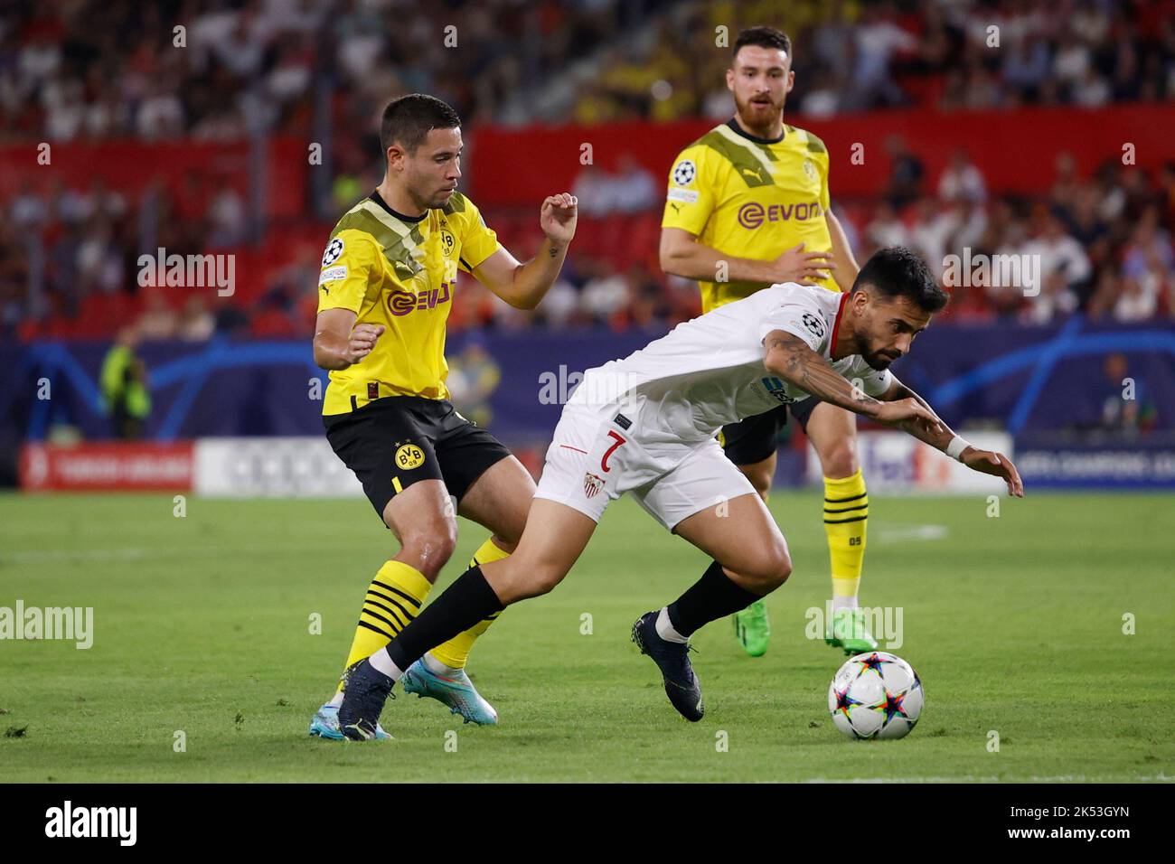 Seville, Spain. 05th Oct, 2022. Raphael Guerreiro (13) of Dortmund and Suso (7) of Sevilla FC seen during the UEFA Champions League match between Sevilla FC and Dortmund at Estadio Ramon Sanchez Pizjuan in Seville. (Photo Credit: Gonzales Photo/Alamy Live News Stock Photo