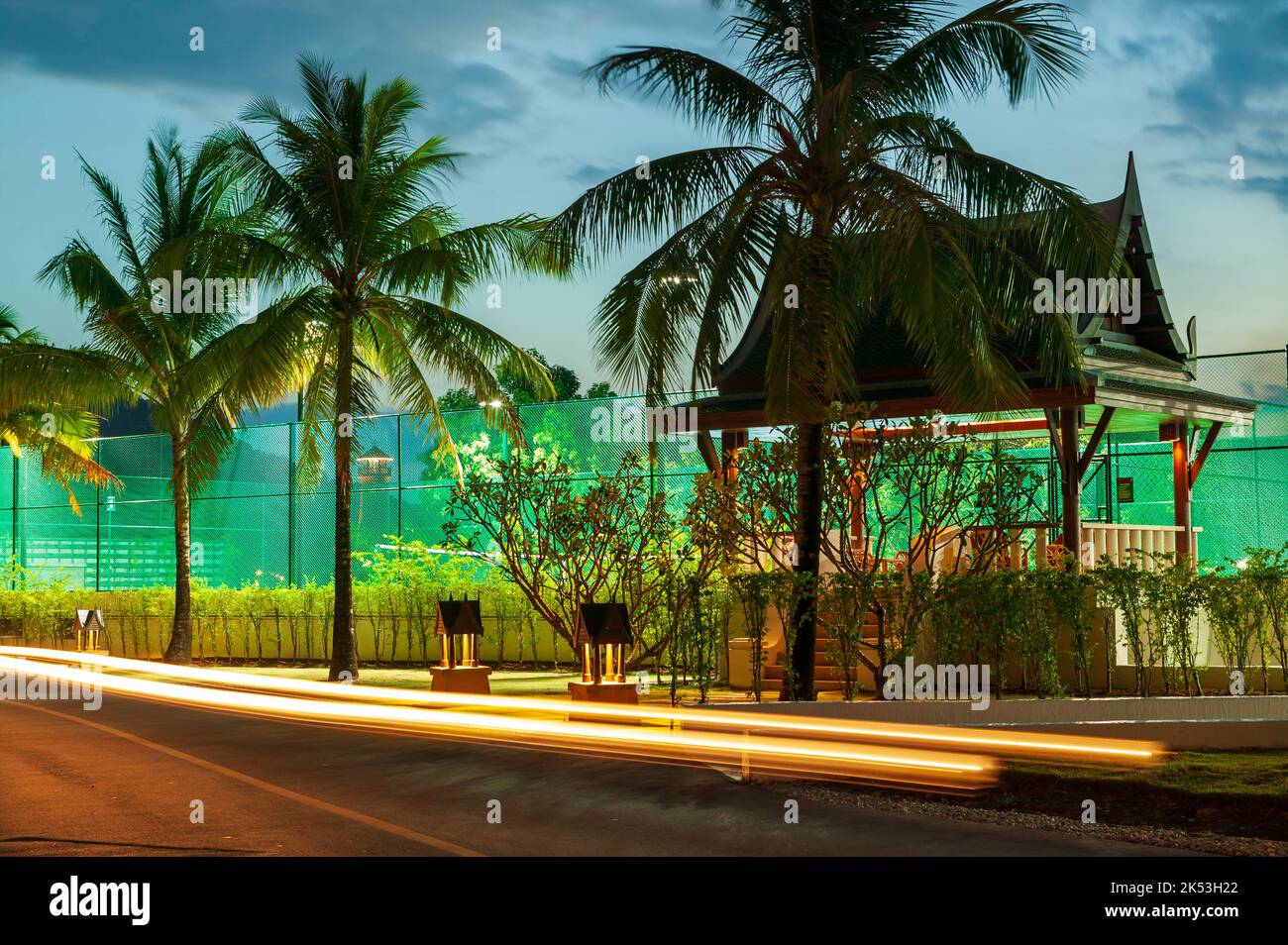 Tennis court and Thai sala architecture at a hotel marina in Phuket