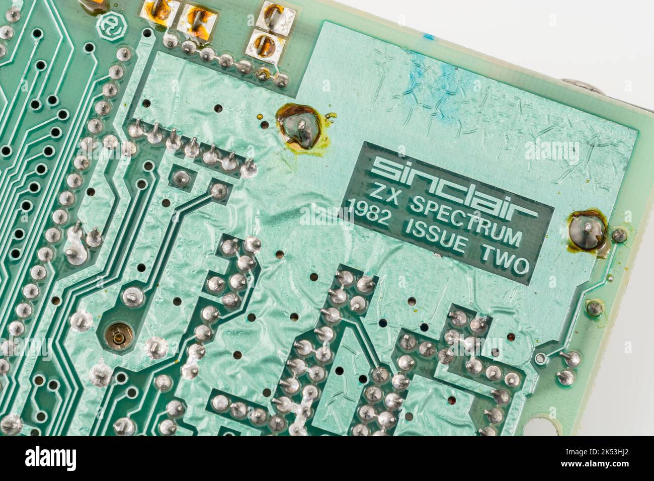 Green motherboard of 1982 Sinclair ZX Spectrum [Issue Two 16k]. For early computing. home computers, British computers, PCB tinning ripples defect. Stock Photo