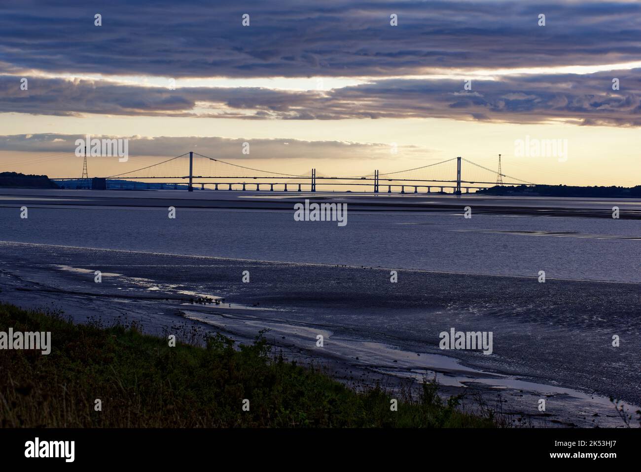 Two Severn Bridges at Sunset connecting South Gloucestershire to South Wales over the River Severn Estuary, UK Stock Photo