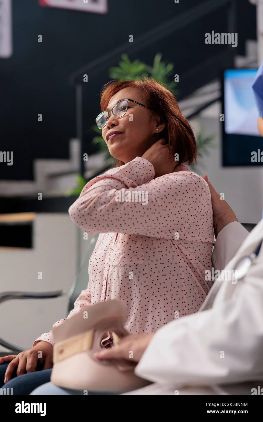Hospital staff helping injured woman with cervical collar, removing