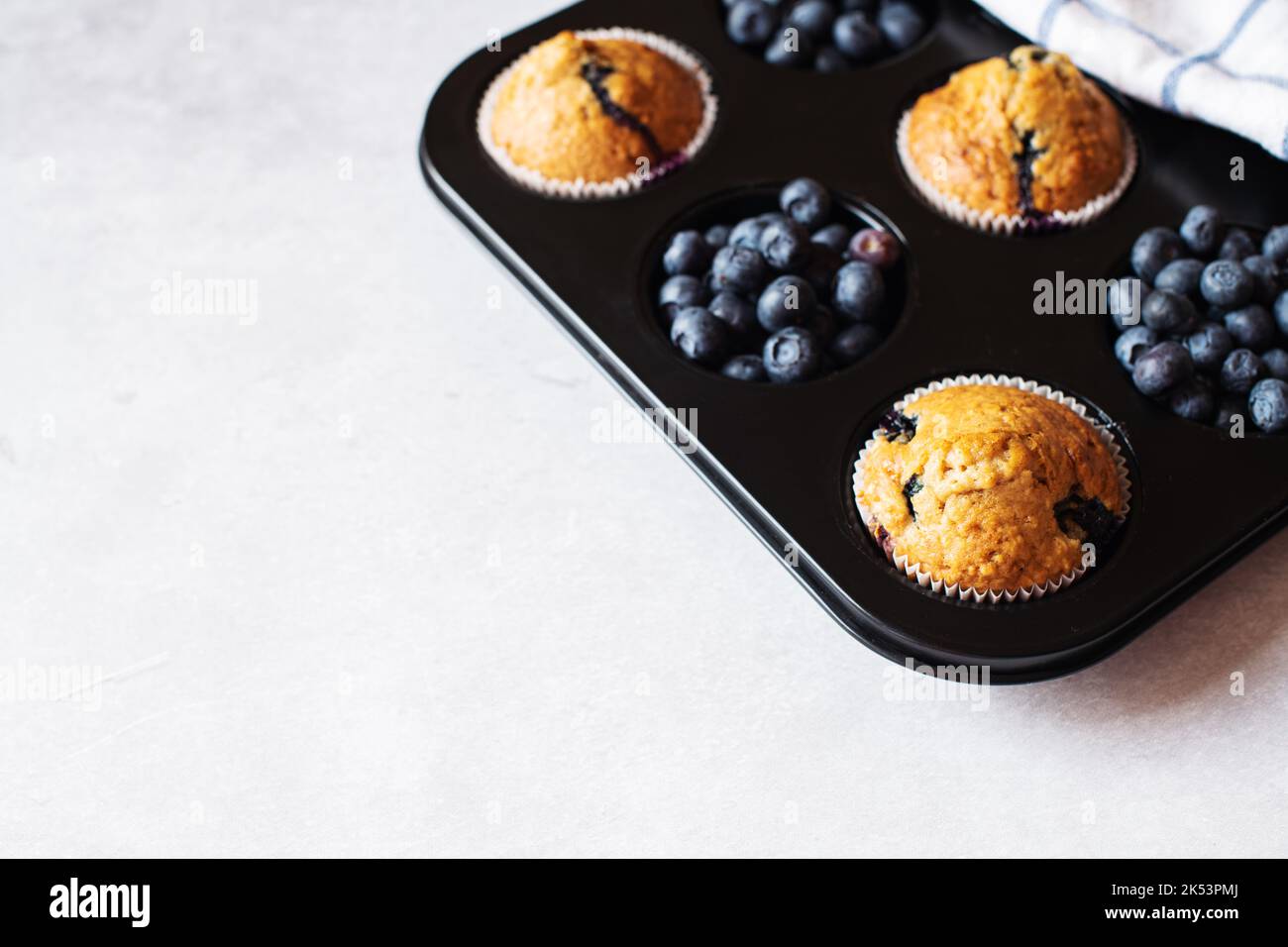 Blueberry muffins on a marble background. Copy space. Stock Photo
