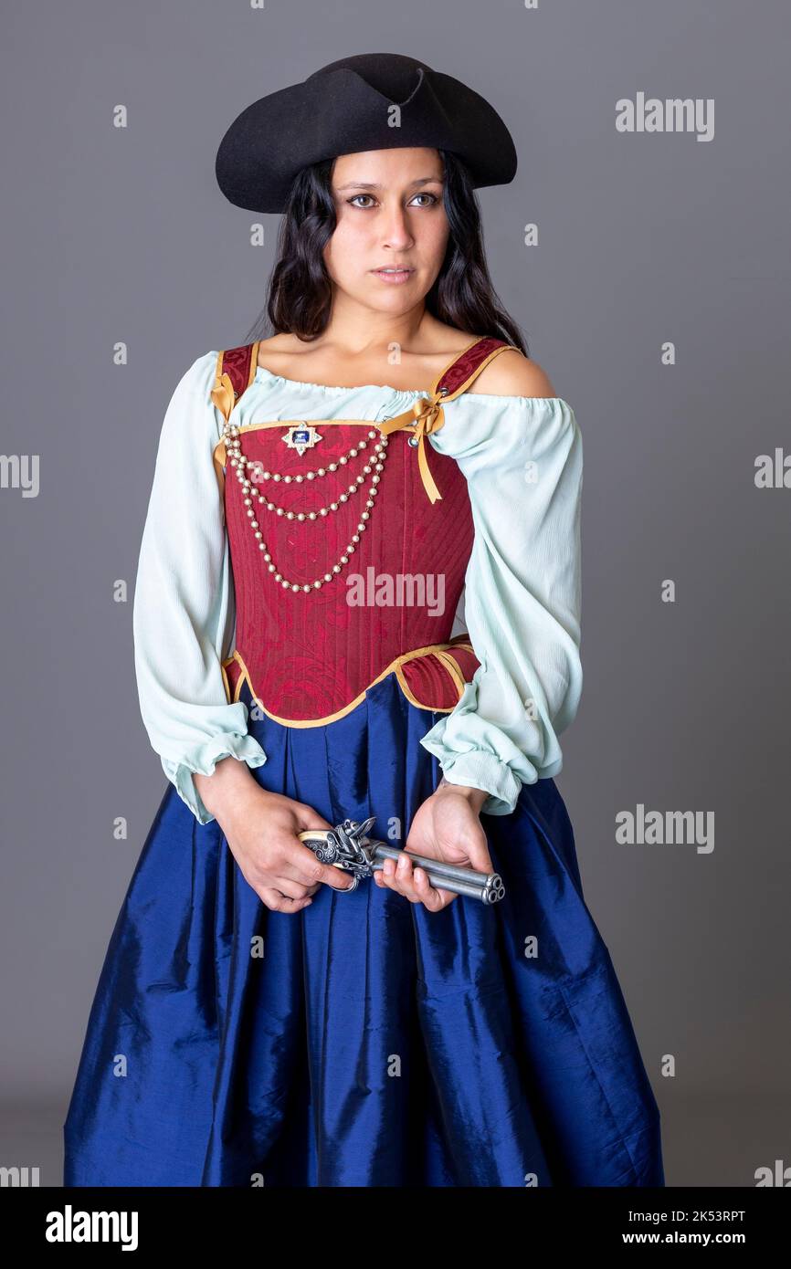 A renaissance or Georgian period pirate woman with long, dark hair Stock Photo