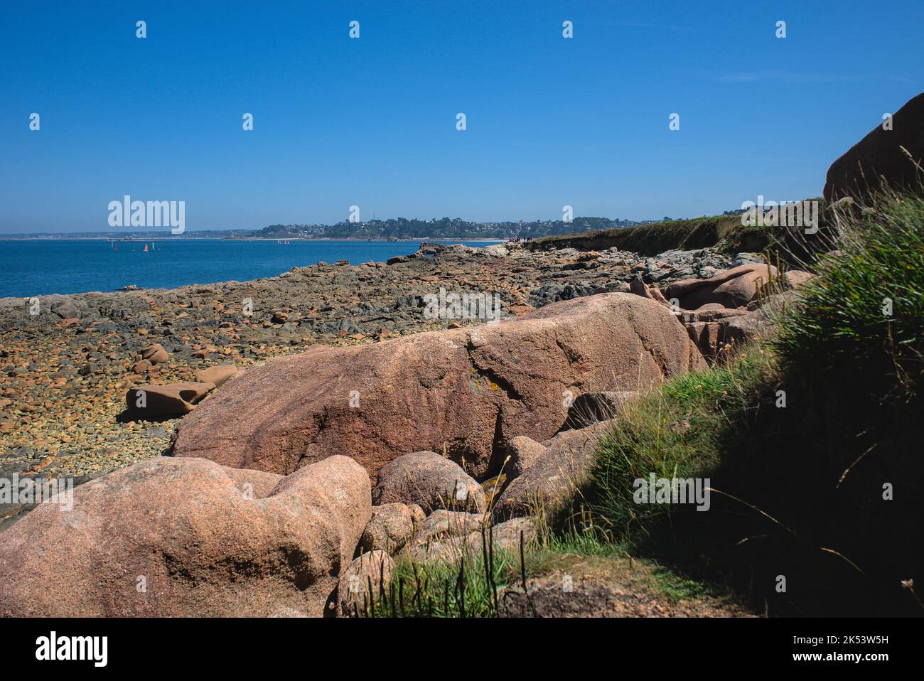 Monolithic blocks of pink granite in the Cotes d'Armor in Brittany, France. Pink granite coast Stock Photo