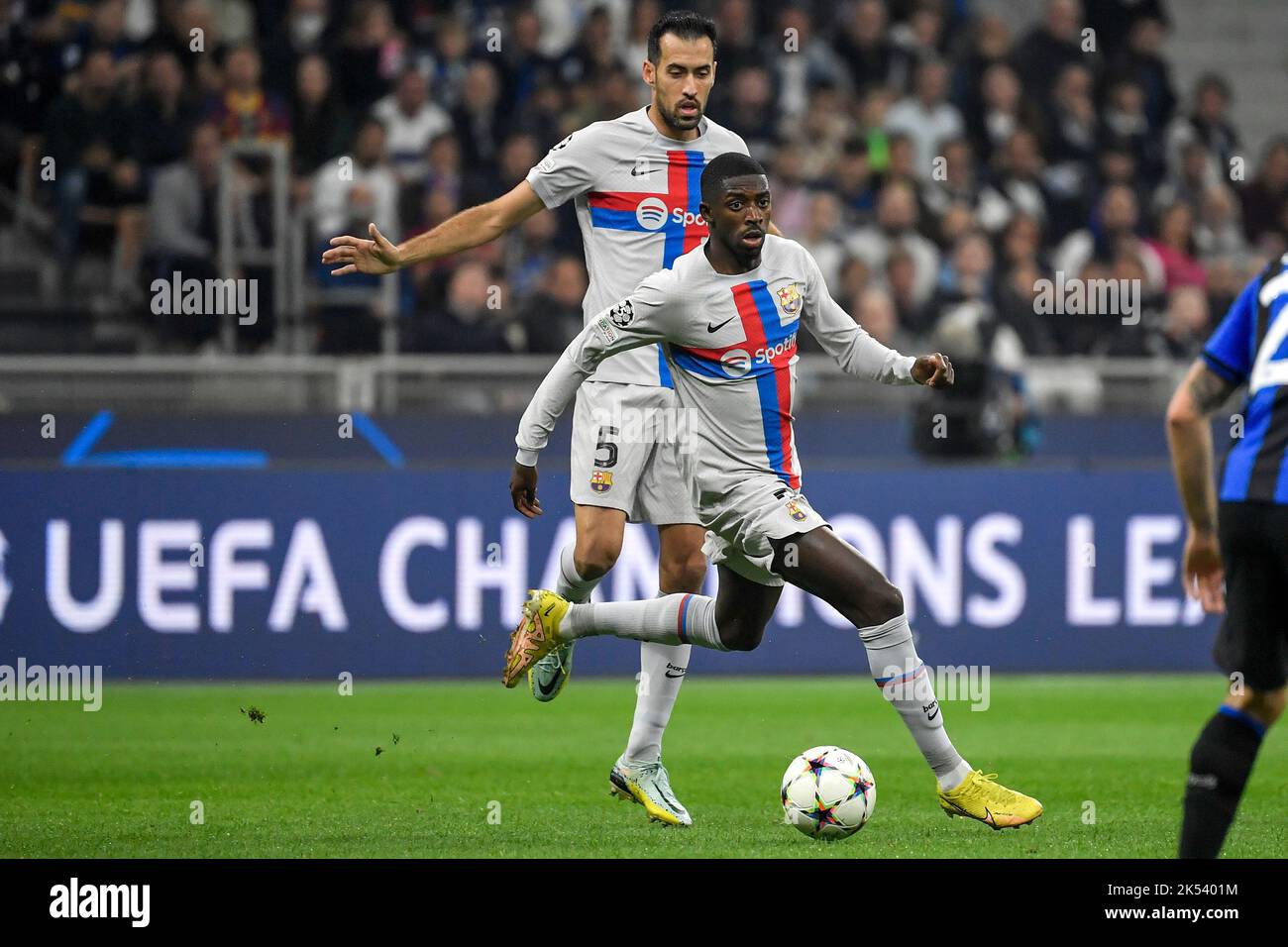 Sergio Busquets and Ousmane Dembele of Barcelona  during the Champions League Group C football match between FC Internazionale and FCB Barcelona at Sa Stock Photo