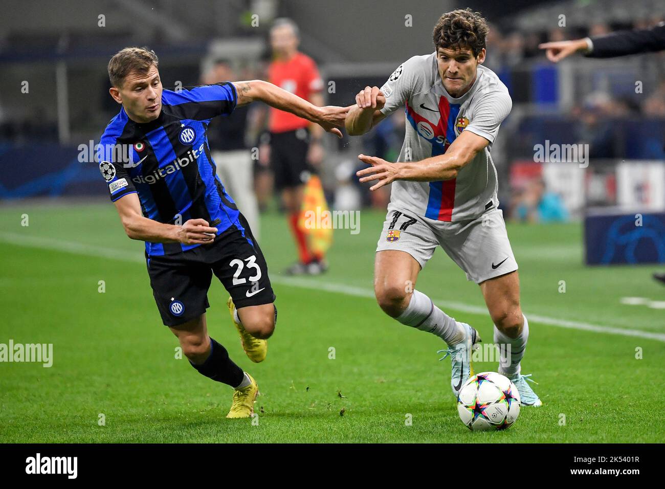 Nicolo Barella of Fc Internazionale and Marcos Alonso of Barcelona compete for the ball during the Champions League Group C football match between FC Stock Photo