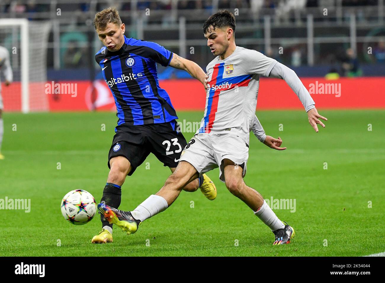 Nicolo Barella of Fc Internazionale and Pedro Gonzalez Lopez aka Pedri of Barcelona compete for the ball during the Champions League Group C football Stock Photo