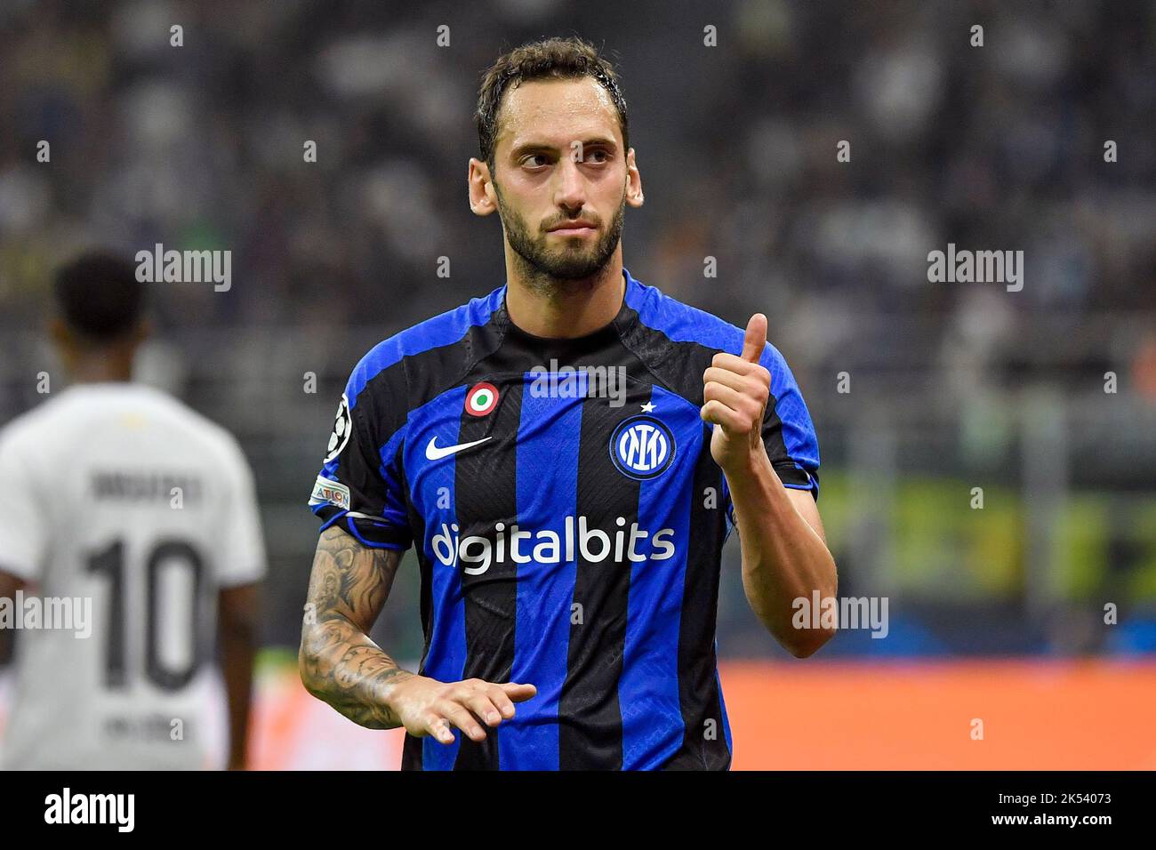 Hakan Calhanoglu of Fc Internazionale ireacts during the Champions League Group C football match between FC Internazionale and FCB Barcelona at San Si Stock Photo