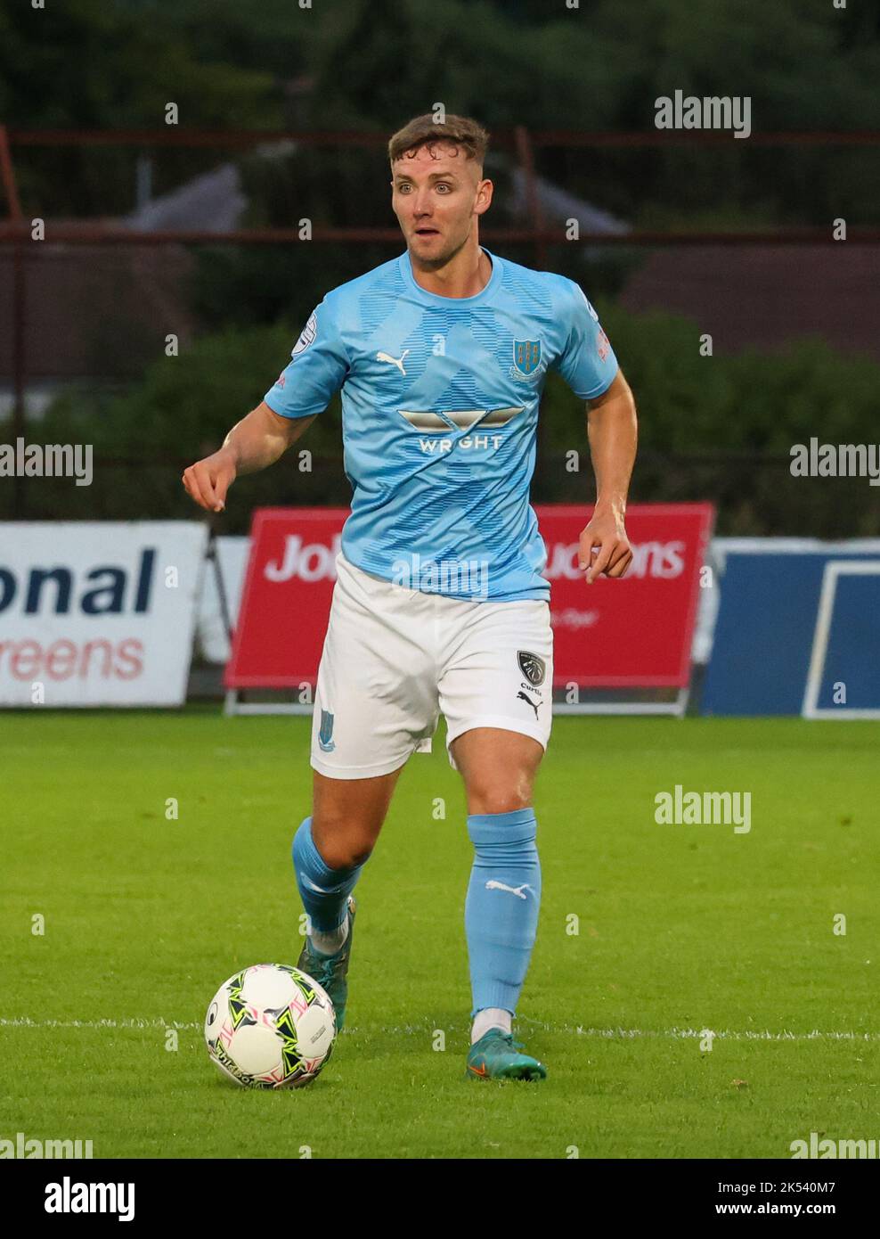 Ballymena Showgrounds, Ballymena, County Antrim, Northern Ireland, UK. 23 Aug 2022. Danske Bank Premiership – Ballymena United 1 Cliftonville 2. Ballymena United player Jack Henderson (14) in action during the Danske Bank Irish League game. Stock Photo