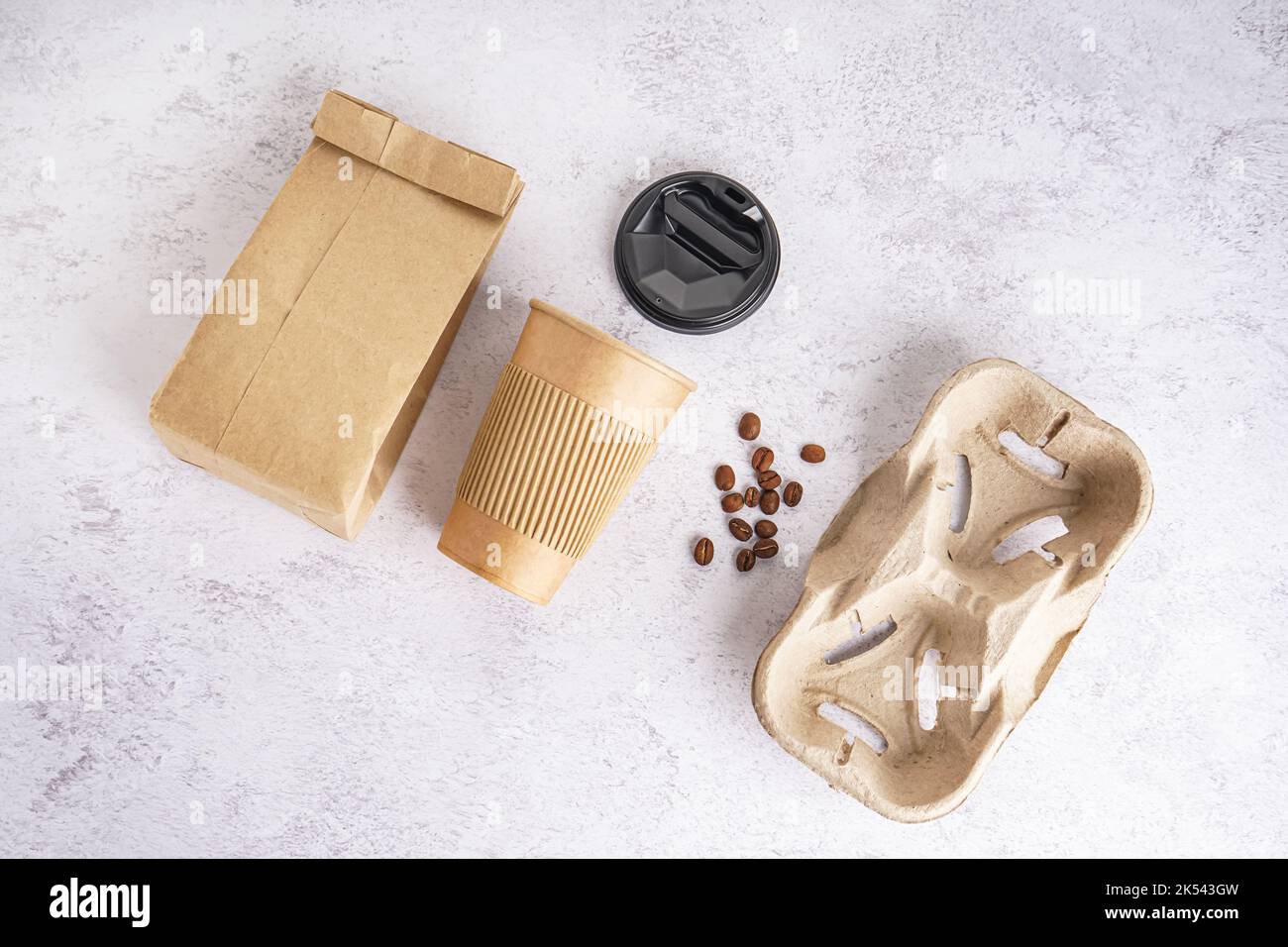 Paper cup, cap, bag and holder on light background Stock Photo - Alamy