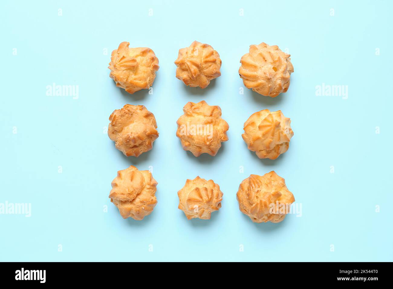 Composition with delicious eclairs on color background Stock Photo
