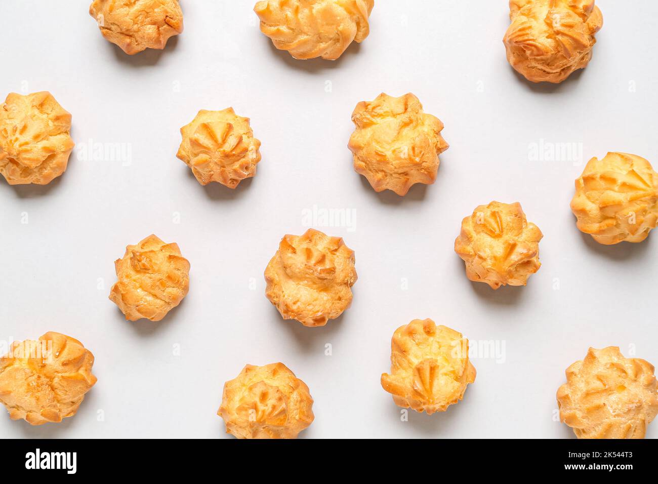 Composition with delicious eclairs on light background Stock Photo