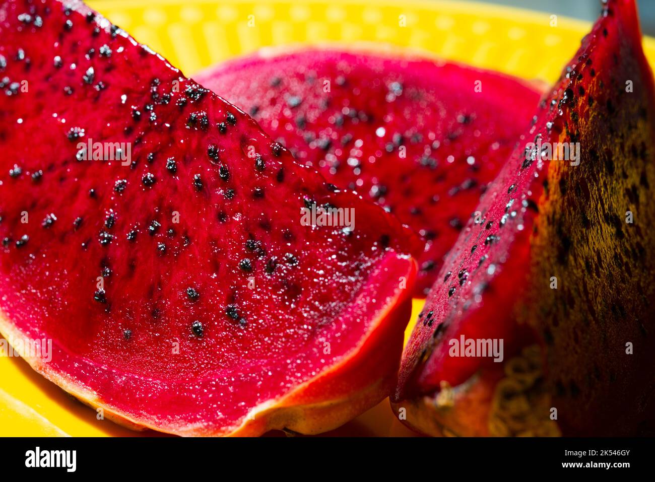 pink pitaya on a yellow plate Stock Photo