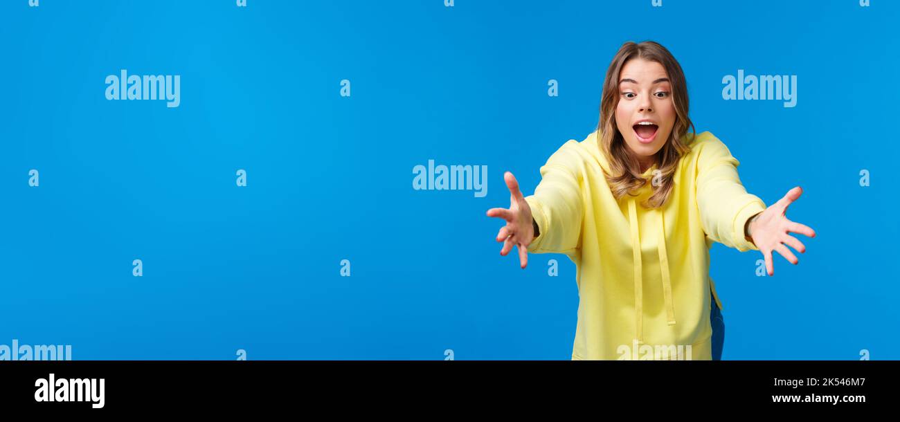 Girl trying to catch somthing, look focused and amused playing with
