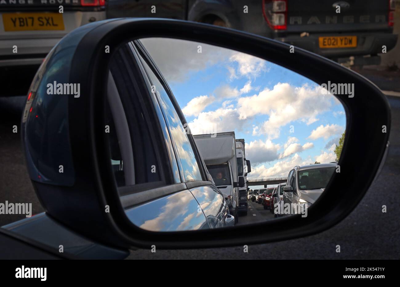 Rear view mirror of a motorway traffic jam in a mirror, M6 Crewe, England, UK Stock Photo