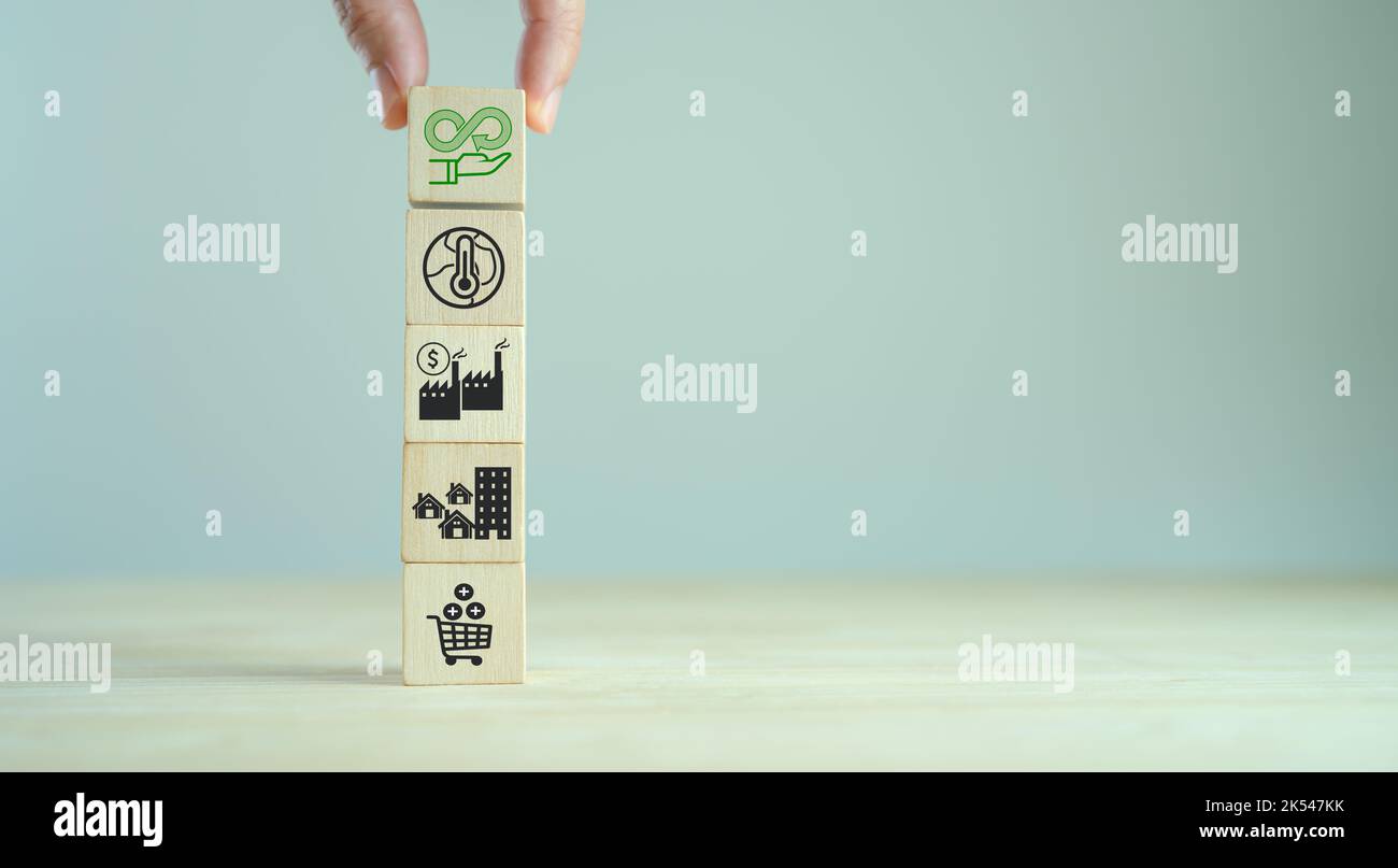 Circular economy concept. Business and environment sustainable. Climate changing problem solving goals. Stacking wooden cubes with sustainability icon Stock Photo