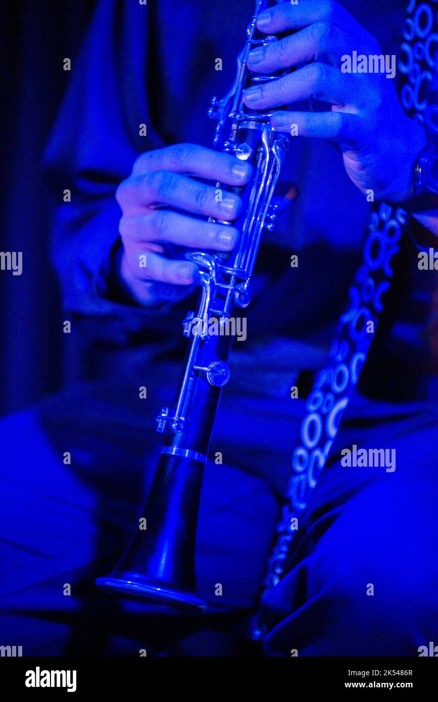 Musicians hands with a black and matching tie in the