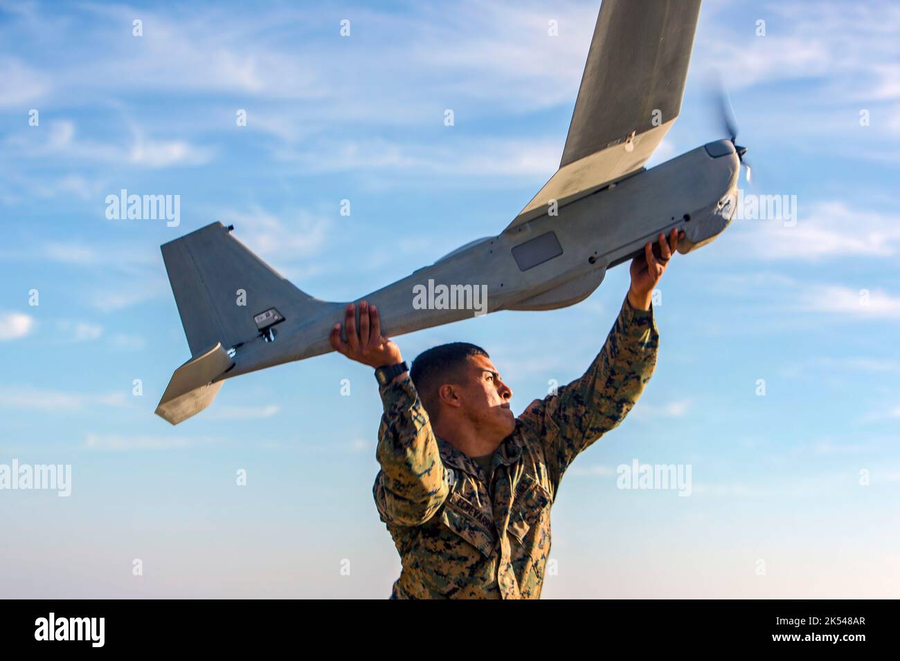 U.S. Marine Corps Lance Cpl. Daniel Echevarria, intelligence analyst, 2nd Battalion, 4th Marine Regiment, 1st Marine Division, launches an RQ-20B Puma drone during Operation Wild Buck (OWB) at Marine Corps Base, Camp Pendleton, Dec. 18, 2018. OWB is a proof of concept exercise designed to demonstrate the potential employment of multiple-integrated unmanned aerial systems for the purposes of tracking missing or unauthorized personnel, animals and in response during wildfires or disasters. (U.S. Marine Corps photo by Cpl. Emmanuel Necoechea) Stock Photo