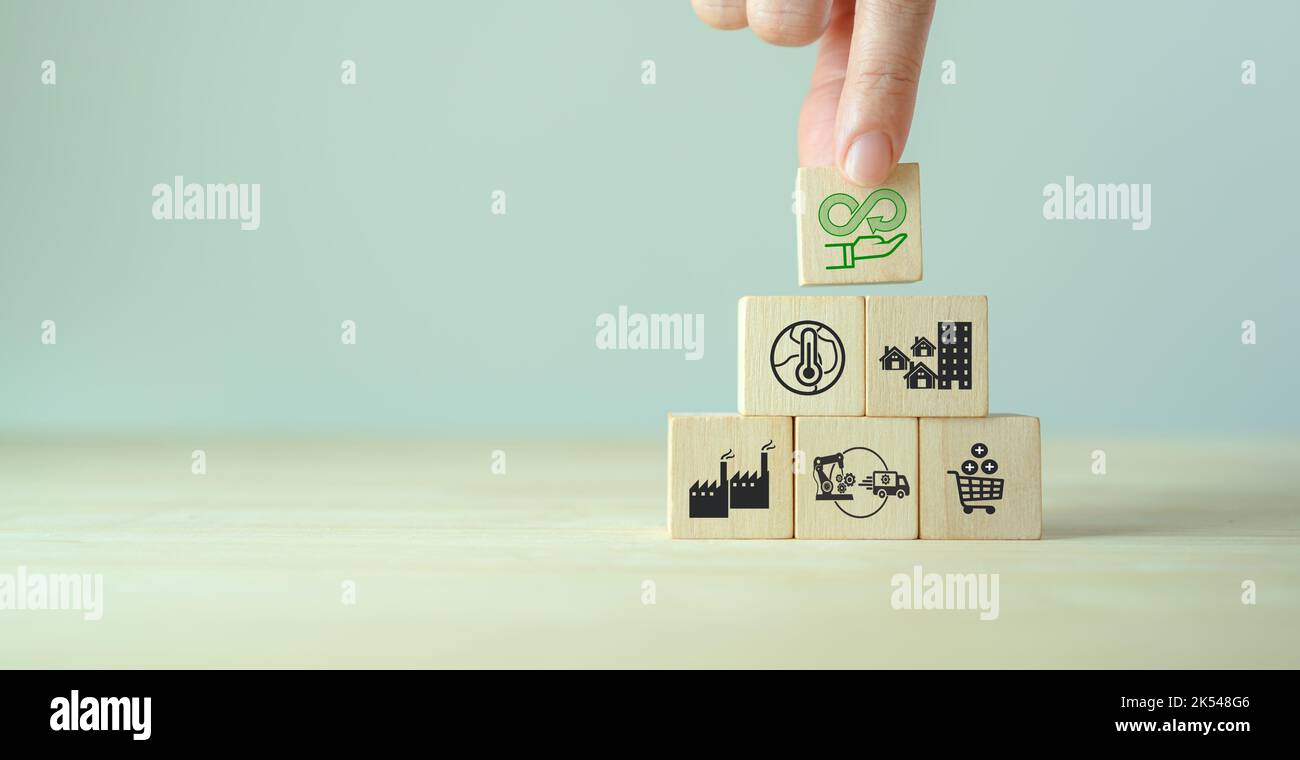 Circular economy concept. Business and environment sustainable. Climate changing problem solving goals. Stacking wooden cubes with sustainability icon Stock Photo