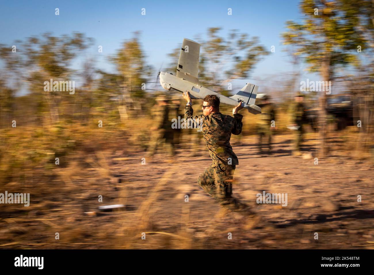 U.S. Marine Corps Cpl. Andrew Abbott with Logistics Combat Element, Marine Rotational Force – Darwin, launches the RQ-20B Puma small unmanned aircraft system at Mount Bundey Training Area, Northern Territory, Australia, Aug. 18, 2020. Abbott is a native of Greenwood, Del. Marines integrated with Australian Army forward observers to support fire missions with real time video feeds from the Puma. (U.S. Marine Corps photo by Cpl. Harrison Rakhshani) Stock Photo