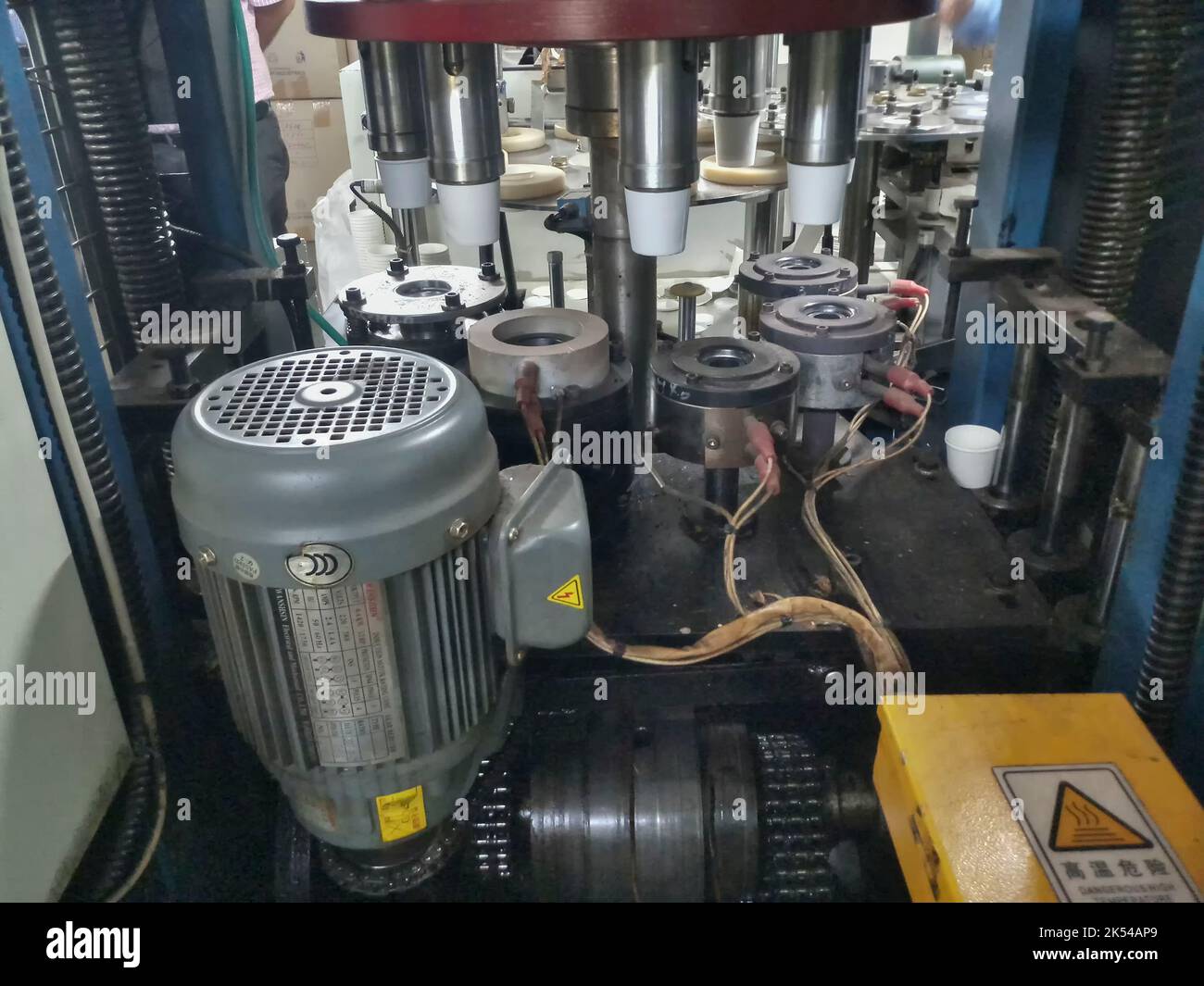 Kolkata, West Bengal, India - 17th May 2019: Paper cups are being made from paper, using paper cup manufacturing machines, Inside view of a running cu Stock Photo