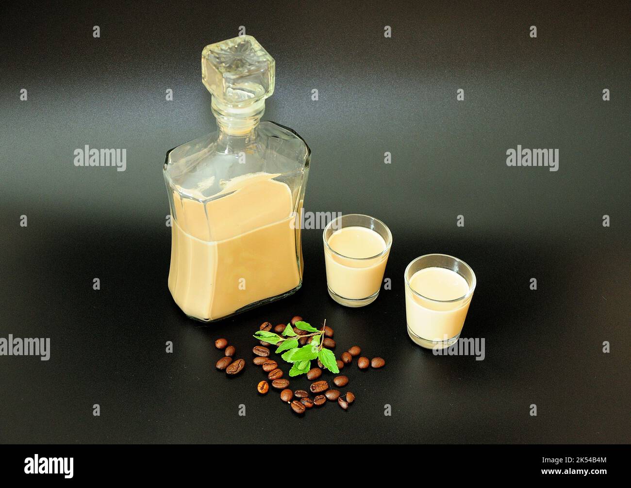 Creamy coffee liqueur, Irish alcohol in a bottle and two glasses on a