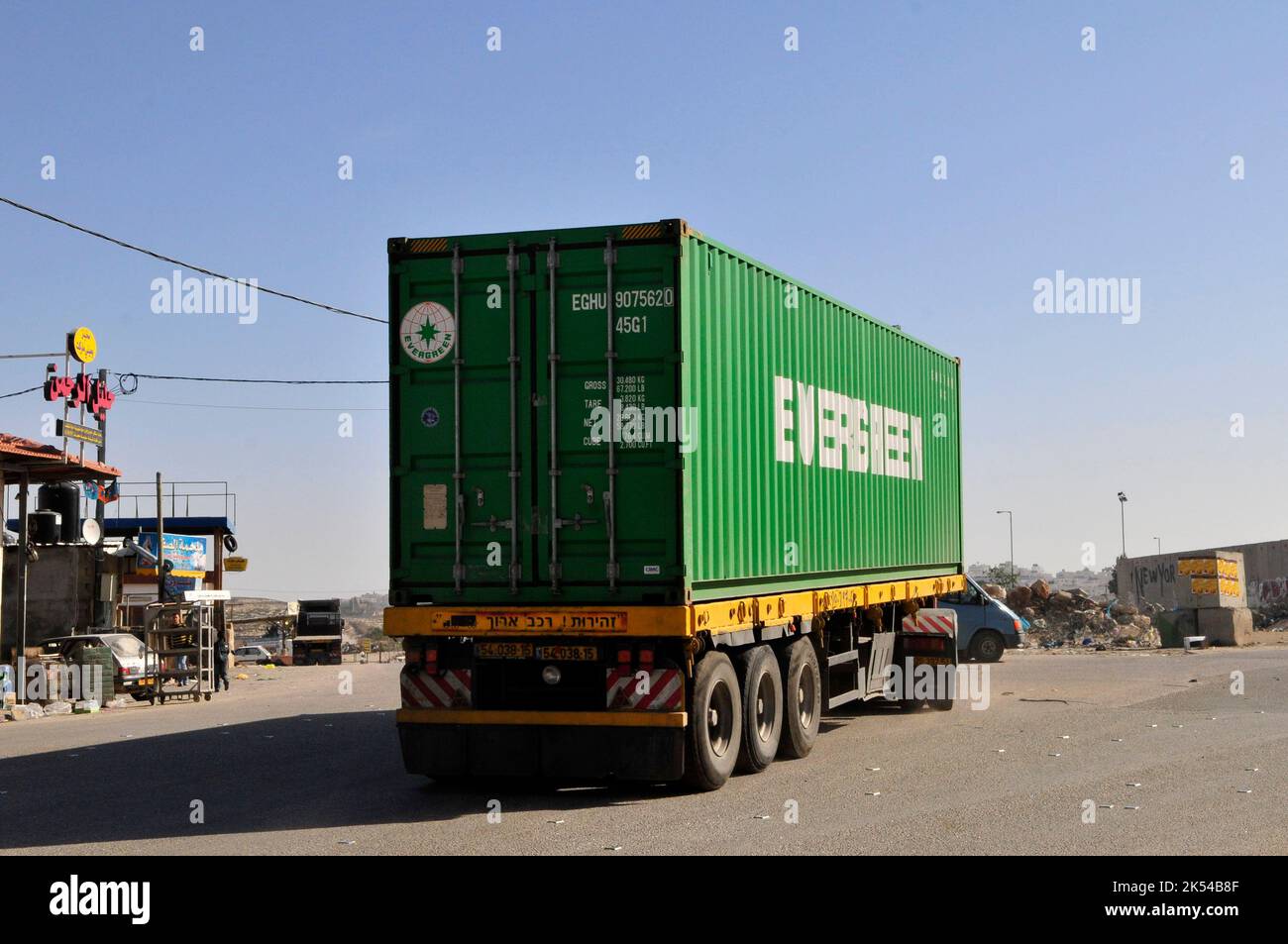 An Evergreen container truck in the West Bank near Jerusalem. Stock Photo