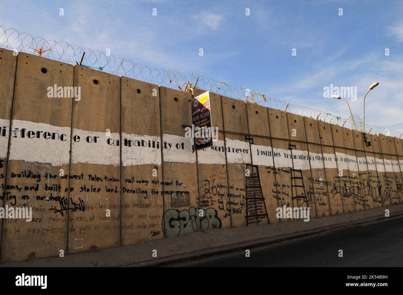 Advertisements hanged on the barrier wall built by Israel in the West Bank, Palestine Stock
