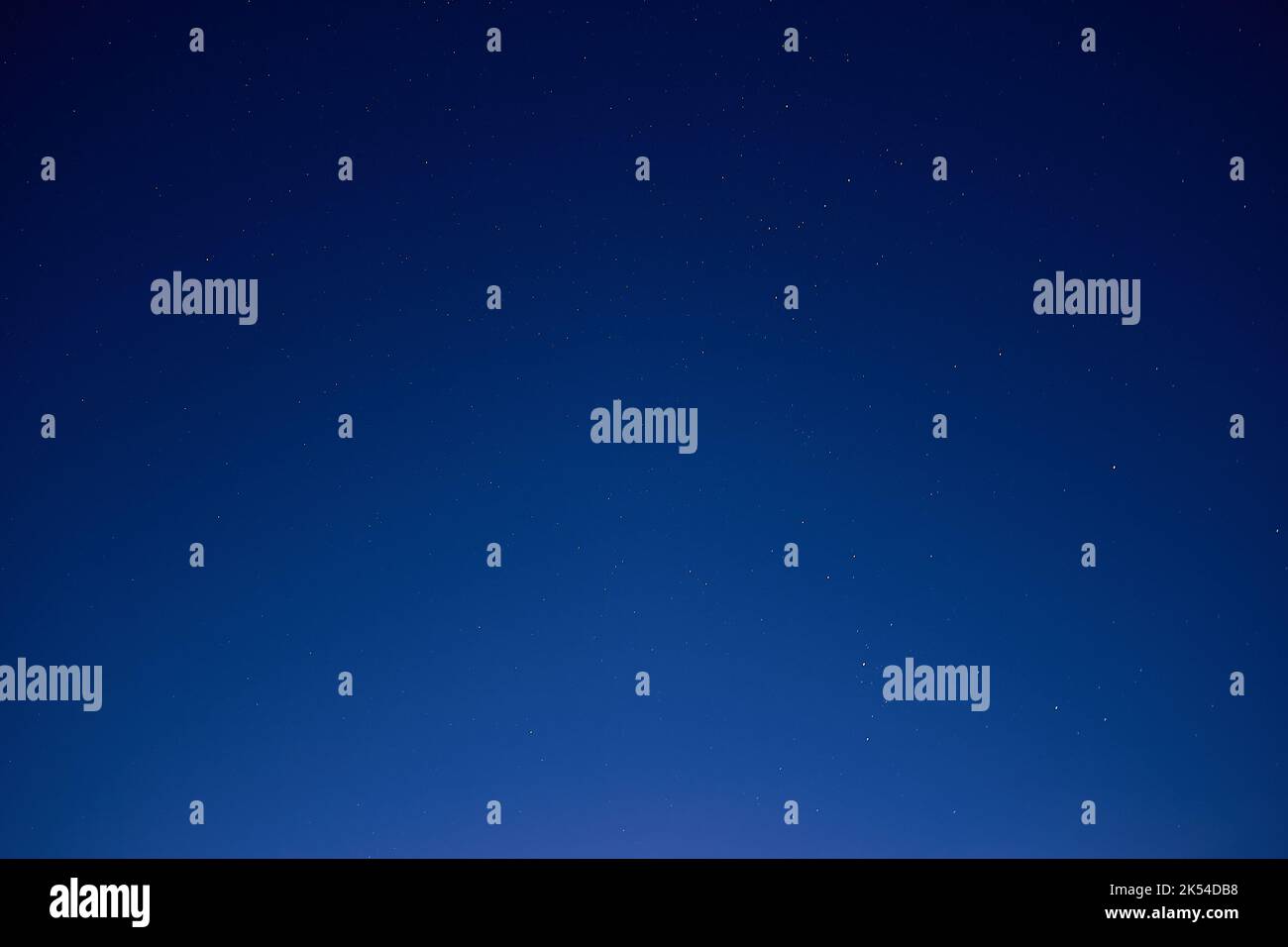 Blue gradient background, night sky with many small stars Stock Photo