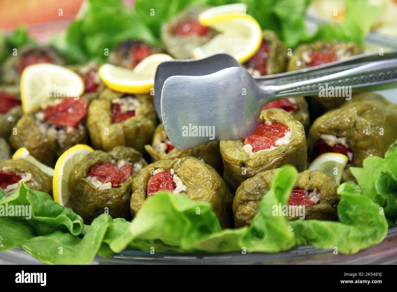 Turkish appetizer food 'Stuffed Peppers' (Biber Dolma) on the dinner plate. Stock Photo