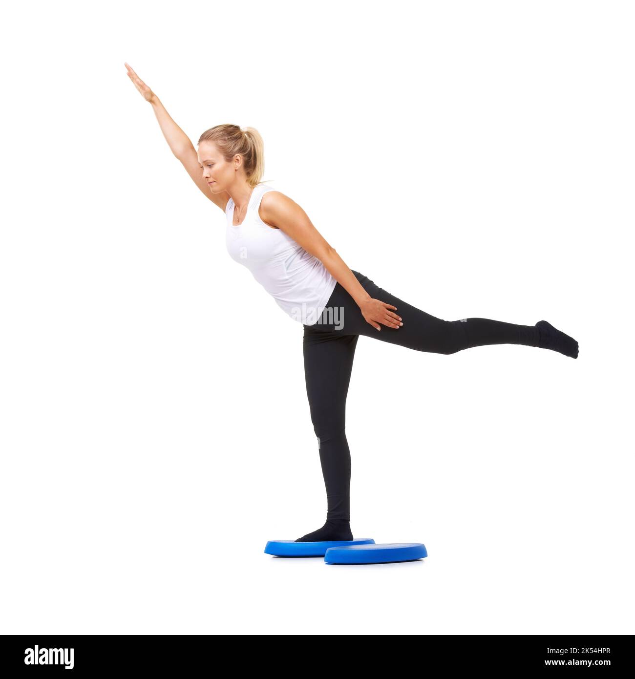Perfecting her balance. Full length studio shot of a young woman doing