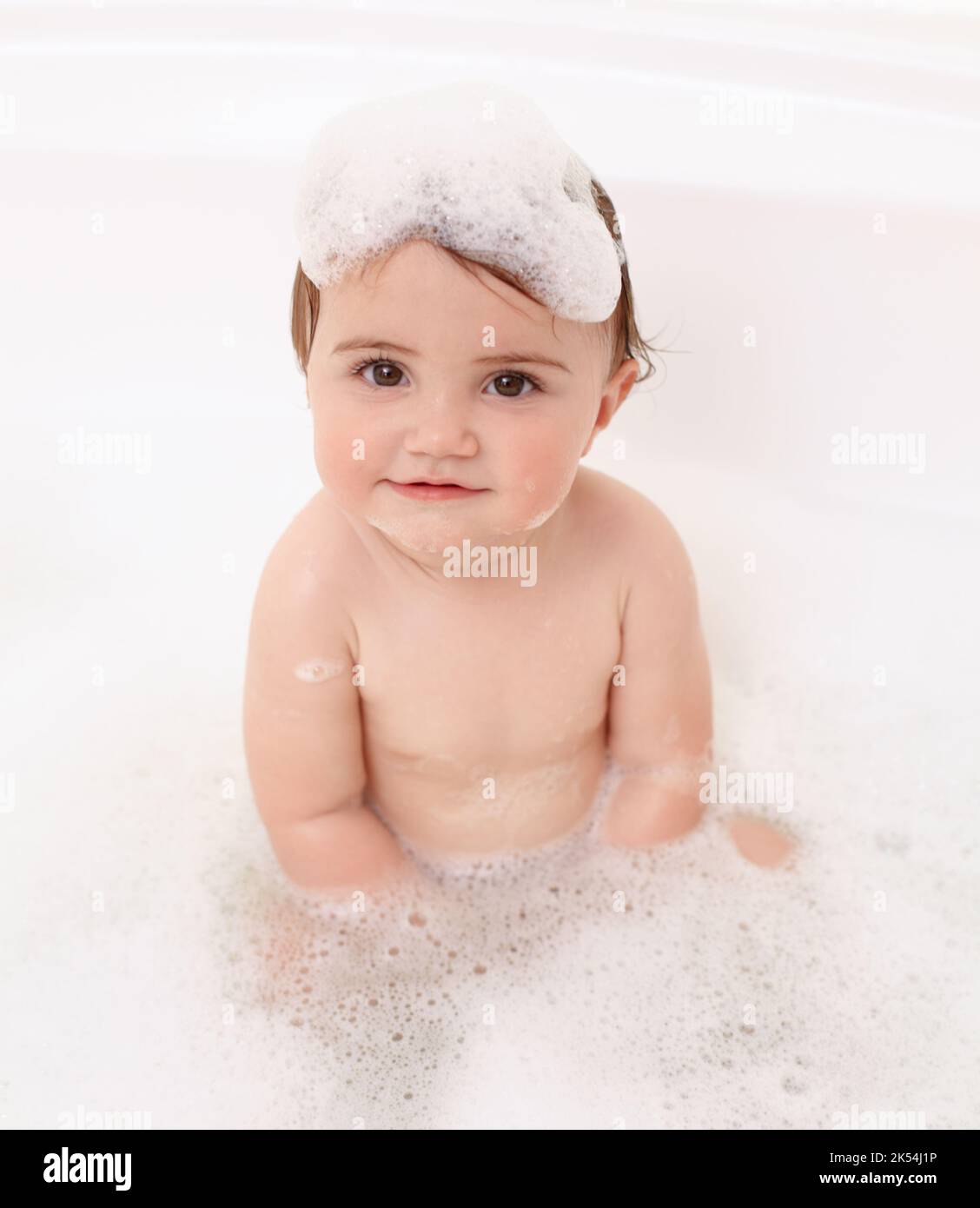 Having fun in the tub. Portrait of an adorable baby girl in the bathtub Stock Photo Alamy