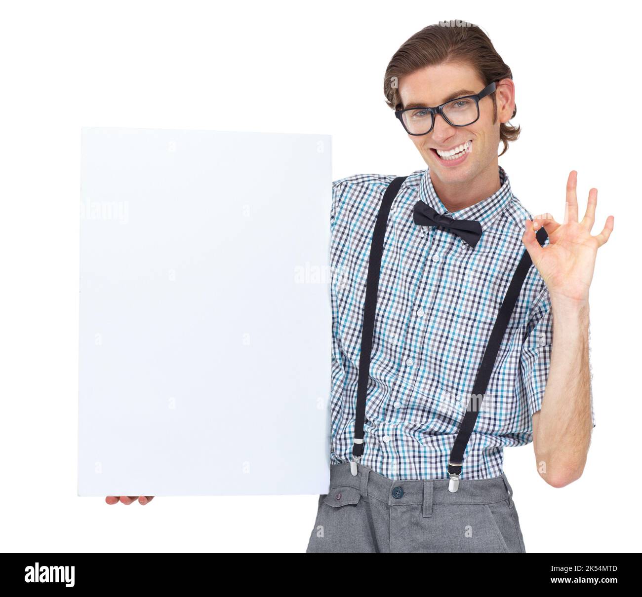 This company gets my stamp of approval. Portrait of a young man holding a blank sign and showing you the a-okay sign. Stock Photo