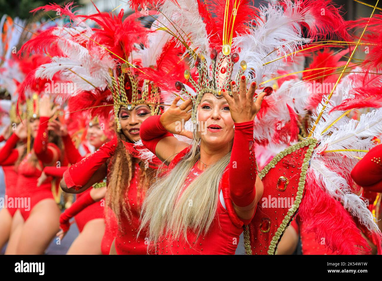 Samba dancers in red feather costumes with Paraiso School of Samba