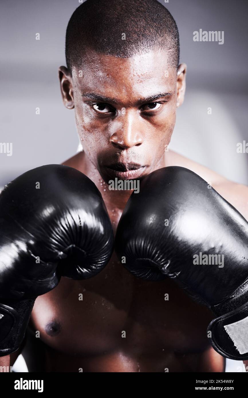 Lets get started. An african american boxer with his gloves up and gum guard in. Stock Photo