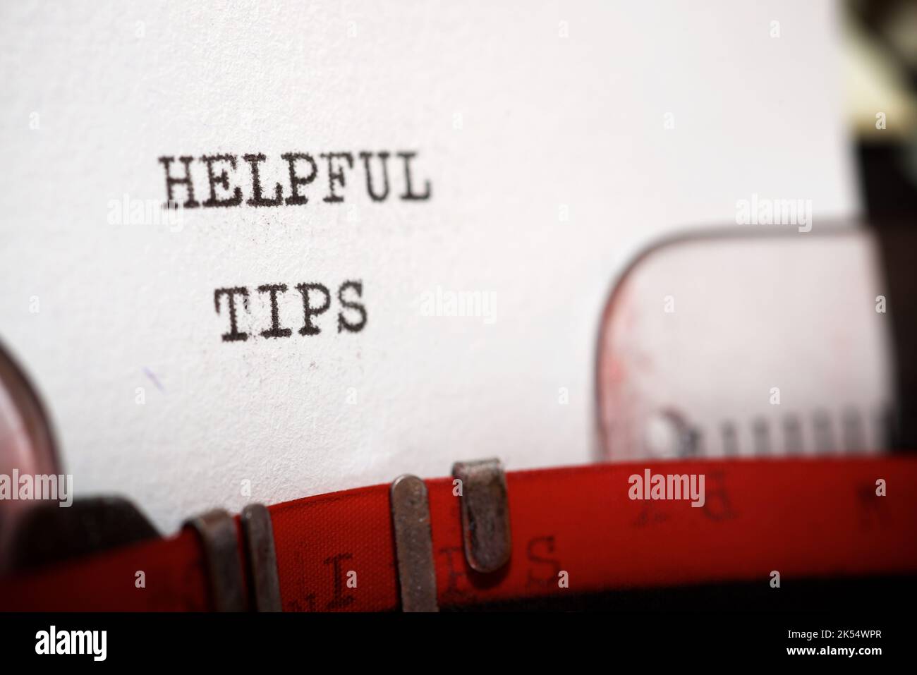 Helpful tips text written with a typewriter. Stock Photo