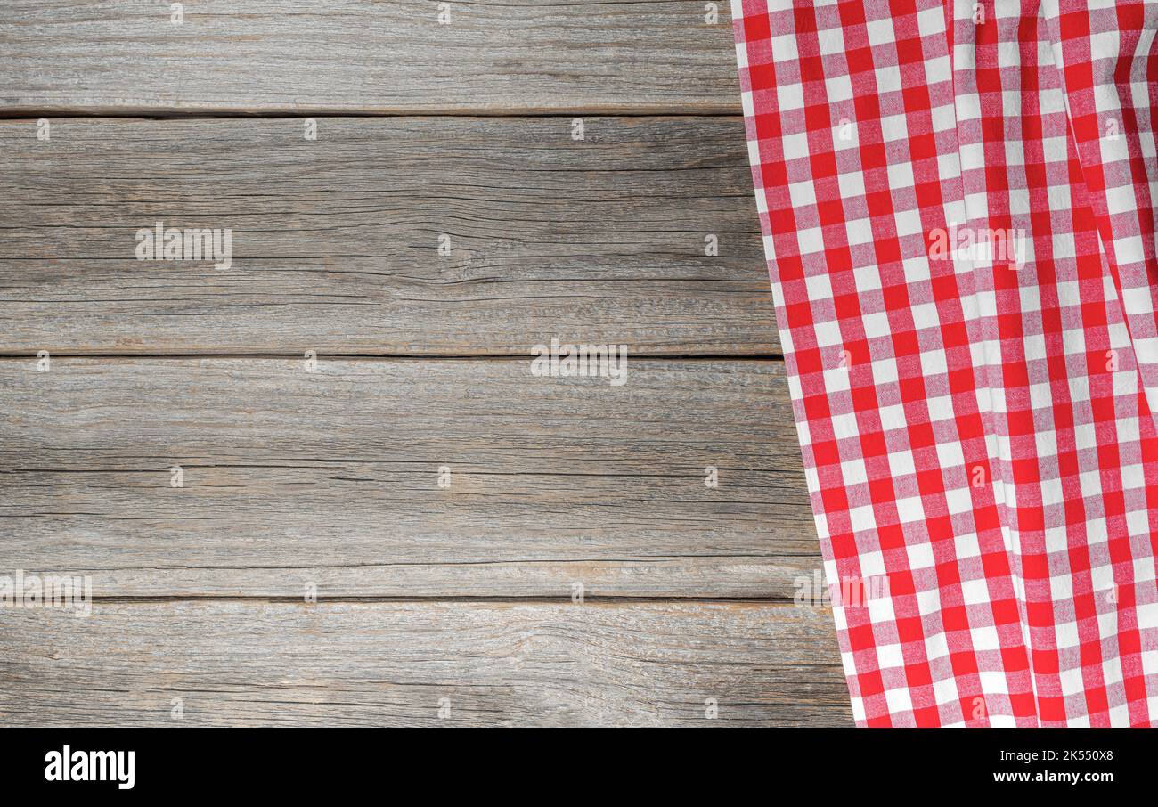 Checkered tablecloth on a wooden background. Stock Photo