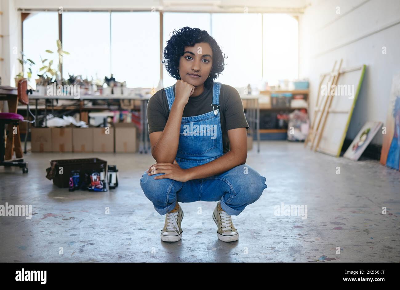 Art, creative and paint with a woman artist in her empty workshop or ...