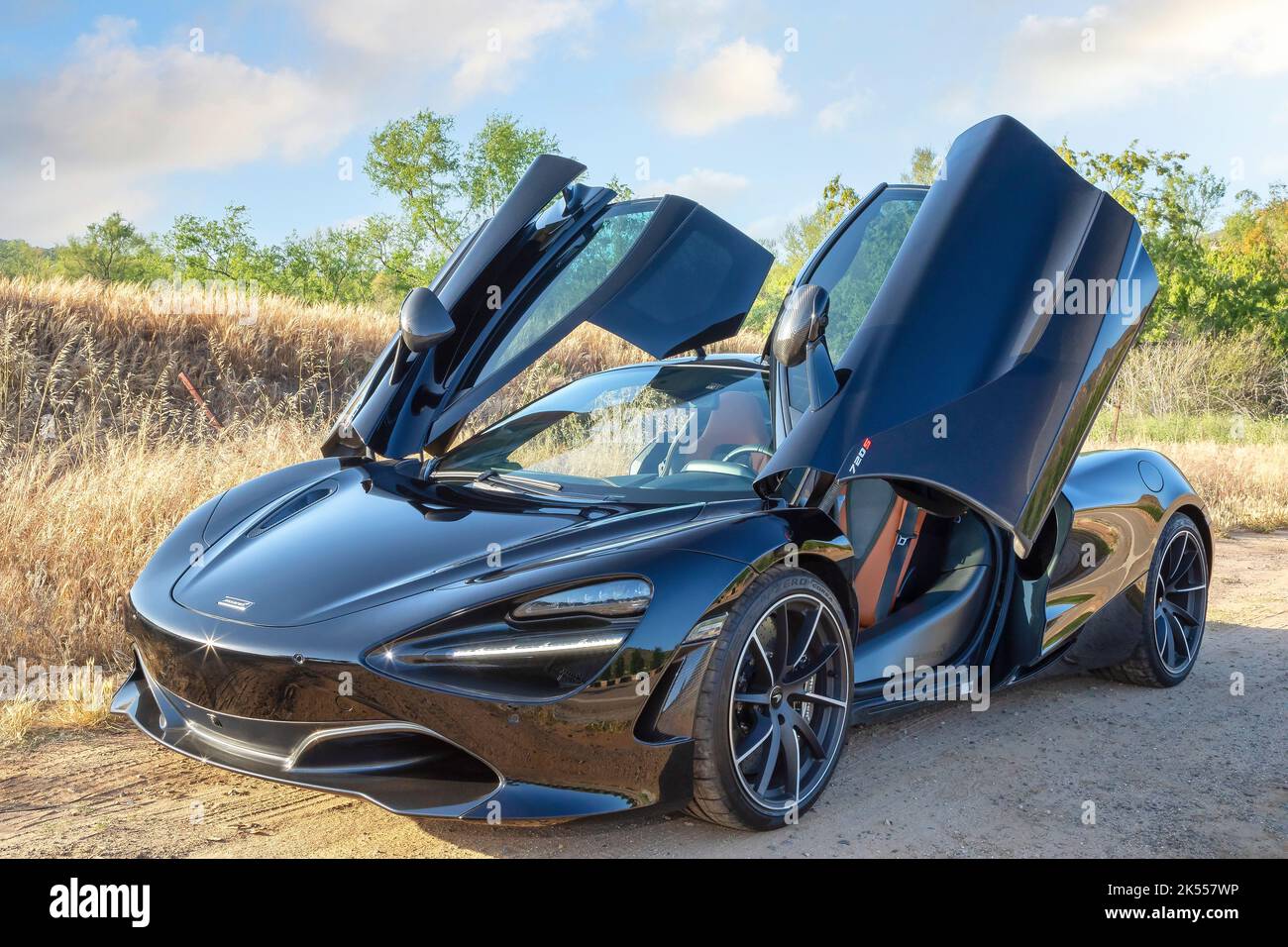 A black McLaren 720S with open doors, San Diego, California Stock Photo