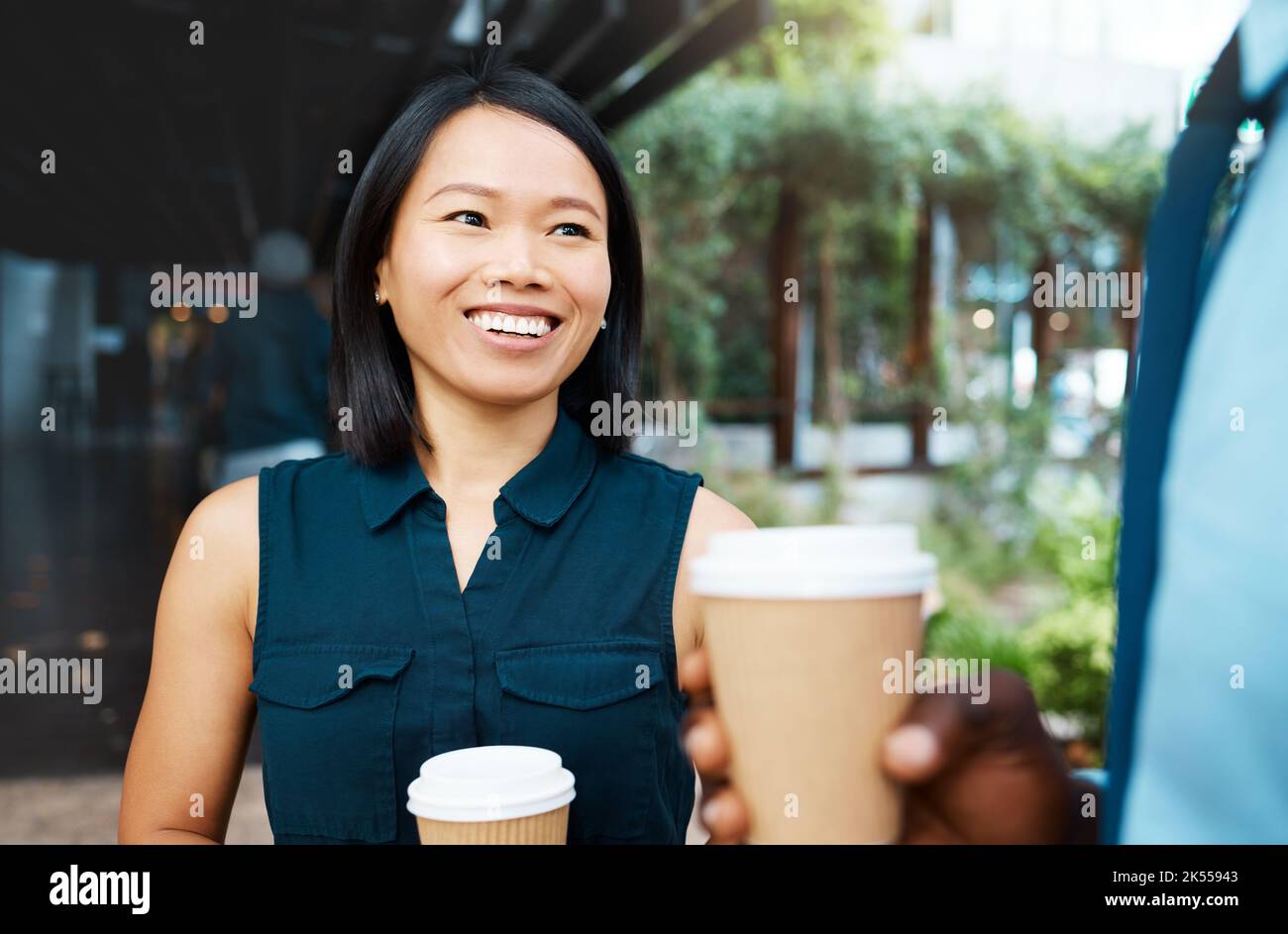 Coffee, communication and Asian woman and black man in city, conversation or talking while drinking espresso. Tea, chatting and business people Stock Photo