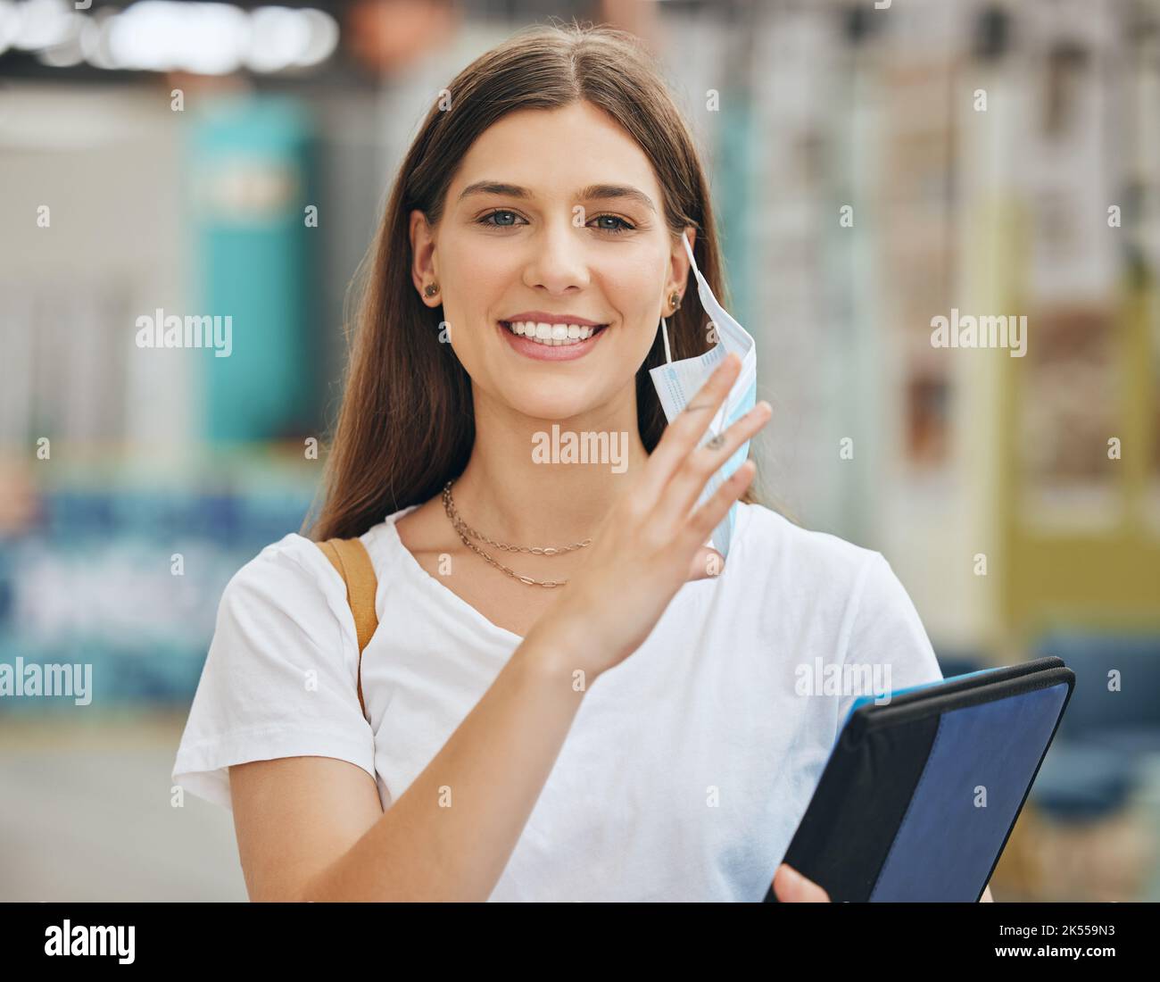 College student woman take off face mask for end of covid pandemic at
