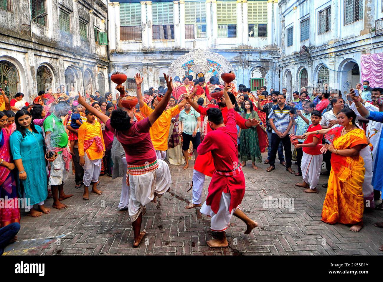 Hindu devotees seen dancing with Dhunachi (Indian incense burner) next