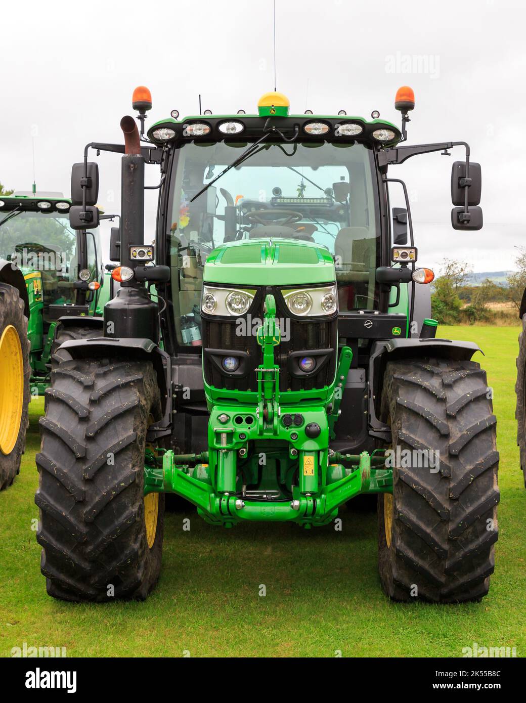 Brydkirk, Scotland - September 04, 2022:  Front view of a John Deere 6155R tractor fitted with front hydraulic three point hitch assembly Stock Photo