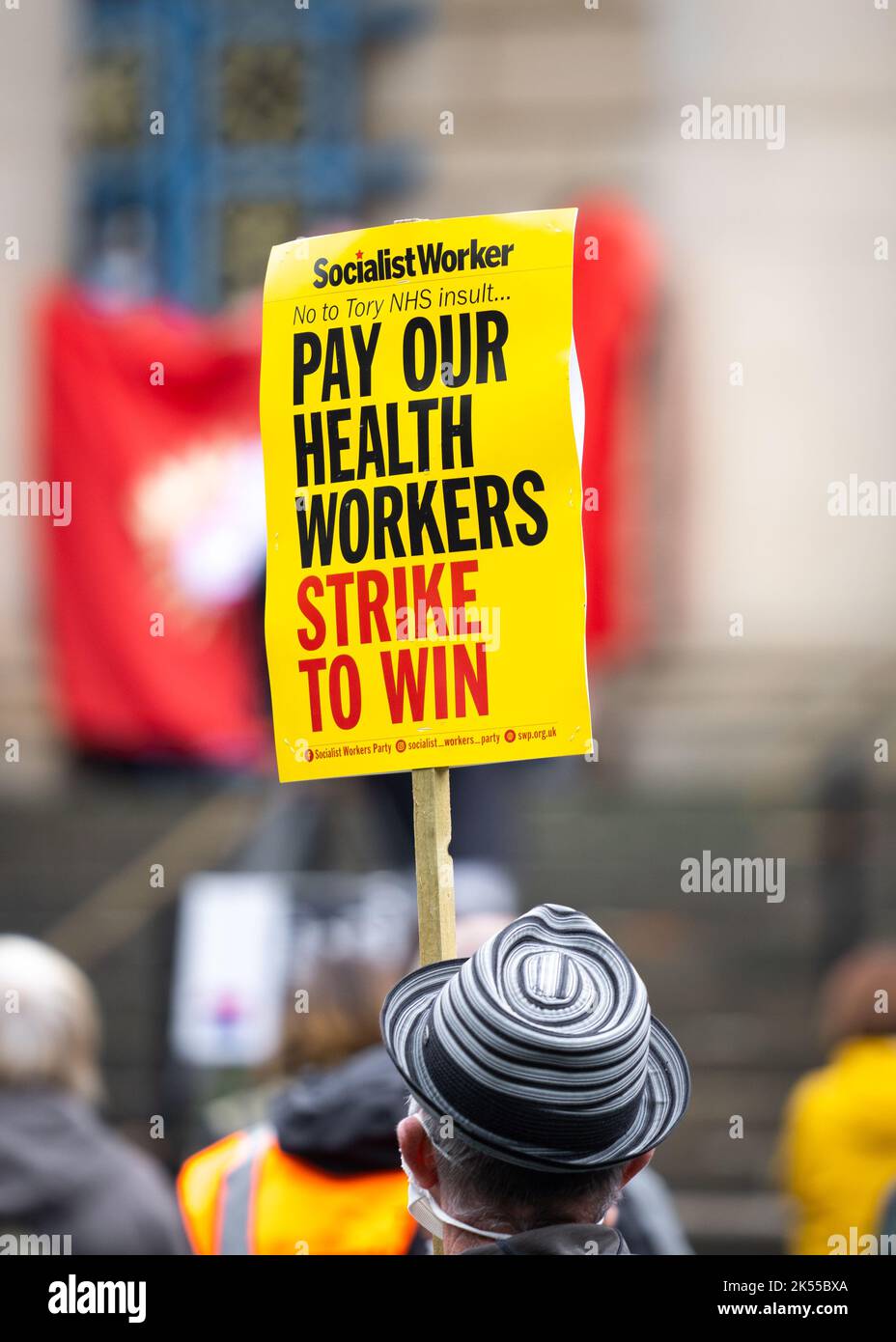 UK NHS Nurses strike action due to lack of pay rises.  Holding signs and placards demanding pay rise above rate of inflation for health workers. Stock Photo