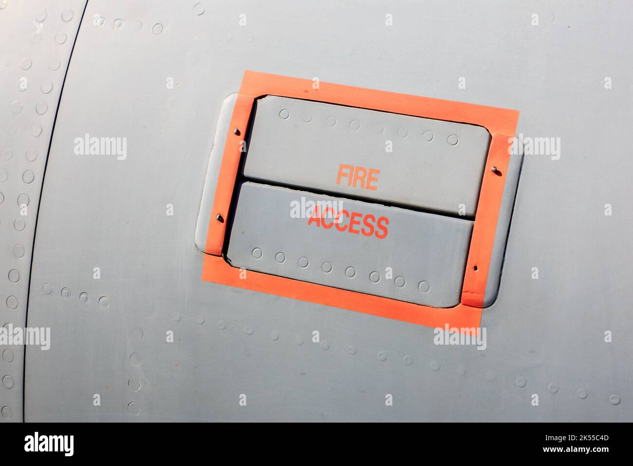 Fire access sign and panel on the side of  an jet plane Stock Photo